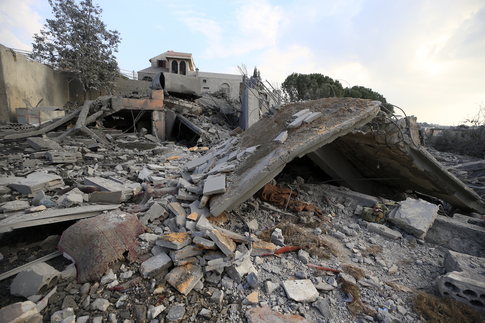 epa11053777 A view of damaged house after an Israeli airstrike on Kafr Kila town, in southern Lebanon, 02 January 2024. Hezbollah said in a statement that three fighters; Jihad Moussa Sheet, Mousa Hassan Sheet and Hussein Ahmad Yahya, all from the border town of Kafr Kila, were killed in Israeli airstrikes in southern Lebanon. Tensions remain high at the border between Israel and Lebanon after the Israeli-Palestinian conflict escalated following an unprecedented attack carried out by Hamas militants from Gaza into Israel on 07 October 2023, and the Israeli operations in Gaza and the West Bank which followed it.  EPA/STR