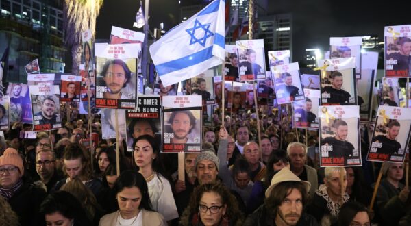 epa11074641 Supporters and families hold pictures of hostages held by Hamas in Gaza as they take part in a '100 Days of Hell' rally calling for their immediate release and marking the upcoming 100th day of their captivity, outside the Kirya military base in Tel Aviv, Israel, 13 January 2024. According to the Israeli government, 136 Israelis are still being held hostage by Hamas in the Gaza Strip. According to organizers, some 120,000 people attended the rally to mark the upcoming one-hundredth day, on 14 January 2024, since the 07 October Hamas attack on Israel. More than 23,600 Palestinians and at least 1,300 Israelis have been killed, according to the Palestinian Health Ministry and the Israel Defense Forces (IDF), since Hamas militants launched an attack against Israel from the Gaza Strip on 07 October, and the Israeli operations in Gaza and the West Bank which followed it.  EPA/ABIR SULTAN