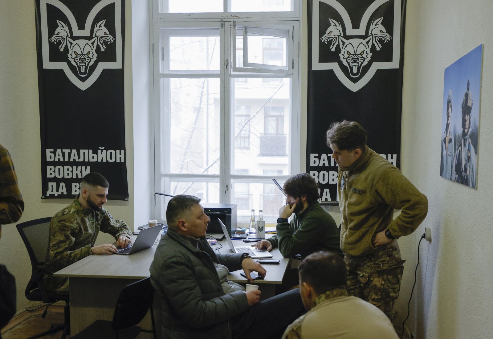 epa11142328 Recruiting center members attend the opening of the 'Da Vinci Wolves' battalion recruiting center in Kyiv (Kiev), Ukraine, 10 February 2024, amid the Russian invasion. The Separate Mechanized Battalion 'Da Vinci Wolves' named after 'Dmytro Kotsiubailo' announced the opening of recruiting centers in several cities across the country. The volunteer battalion was created in 2014 by its first commander Dmytro Kotsiubailo, who died in combat near the frontline city of Bakhmut in March 2023. Russian troops entered Ukrainian territory on 24 February 2022, starting a conflict that has provoked destruction and a humanitarian crisis.  EPA/SERGEY DOLZHENKO