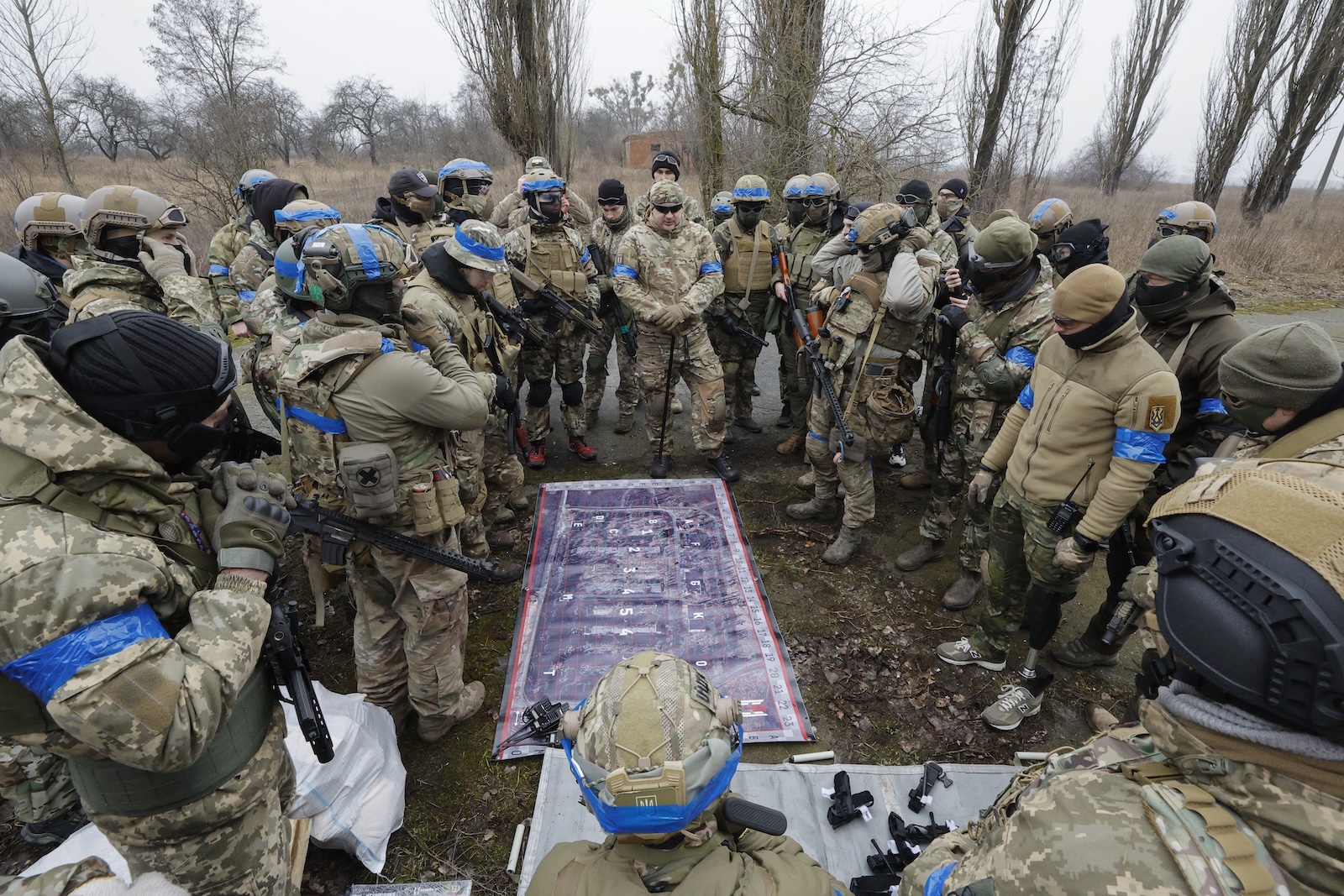 epa11161432 Ukrainian civilians attend a military training near Kyiv, Ukraine, 17 February 2024. The training of Ukrainians is carried out by instructors of the Ukrainian Volunteer Army (UDA), who have real combat experience and prepare civilians to defend their country. The Ukrainian Volunteer Army (UDA) is a volunteer military formation established in December 2015 by the former leader of the Right Sector Dmytro Yarosh. After the Russian full-scale invasion, Dmitry Yarosh announced the deployment of all available battalions to the frontline. More than two thousand civilians were trained by UDA fighters on a voluntary basis as organizers told. Russian troops entered Ukrainian territory on 24 February 2022, starting a conflict that has provoked destruction and a humanitarian crisis.  EPA/SERGEY DOLZHENKO 44041