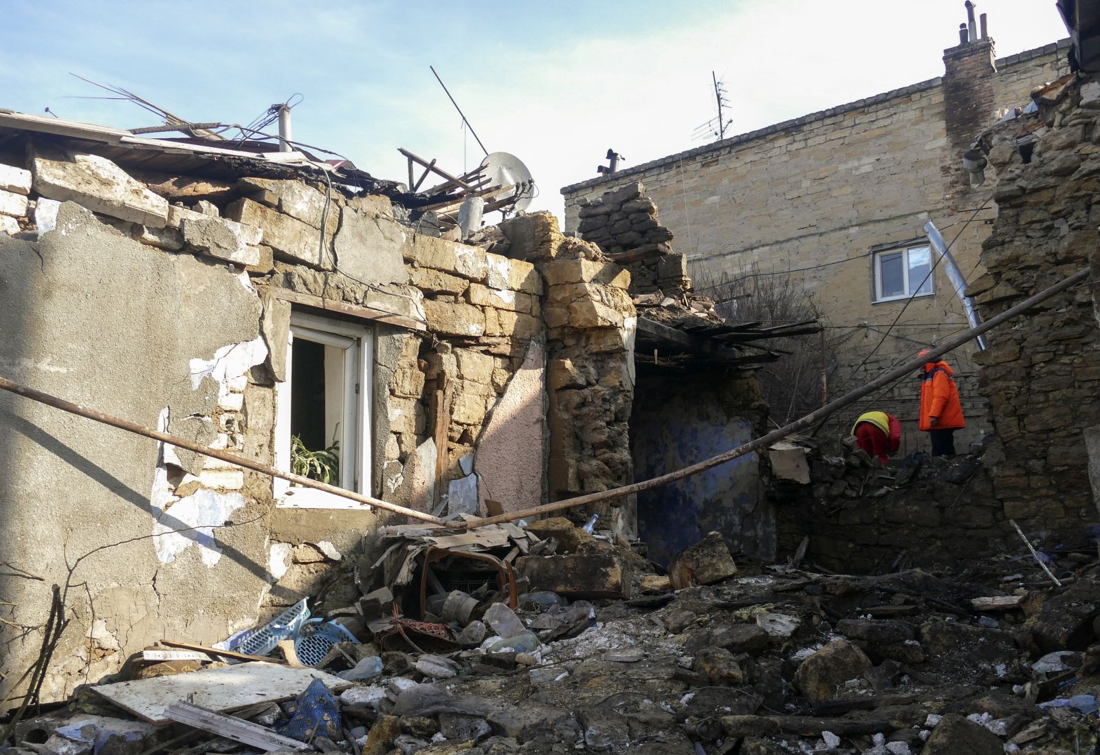 epa11177068 Rescuers work at the site of a damaged building after drone debris fell during an overnight attack in the southern city of Odesa, Ukraine, 24 February 2024, amid the Russian invasion. At least one person was killed and three others injured following a Russian drone attack in Odesa, according to the Ukraine's State Emergency Service report. On 24 February 2024, Ukraine marks the second year since Russian troops entered its territory, starting a conflict that has provoked destruction and a humanitarian crisis.  EPA/IGOR TKACHENKO