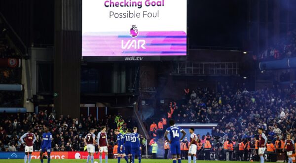 Players wait for referee Craig Pawson to check the VAR before disallowing the goal of Chelsea's French defender #02 Axel Disasi due to an offside position during the English Premier League football match between Aston Villa and Chelsea at Villa Park in Birmingham, central England on April 27, 2024.,Image: 868462195, License: Rights-managed, Restrictions: RESTRICTED TO EDITORIAL USE. No use with unauthorized audio, video, data, fixture lists, club/league logos or 'live' services. Online in-match use limited to 120 images. An additional 40 images may be used in extra time. No video emulation. Social media in-match use limited to 120 images. An additional 40 images may be used in extra time. No use in betting publications, games or single club/league/player publications., Model Release: no, Credit line: Darren Staples / AFP / Profimedia