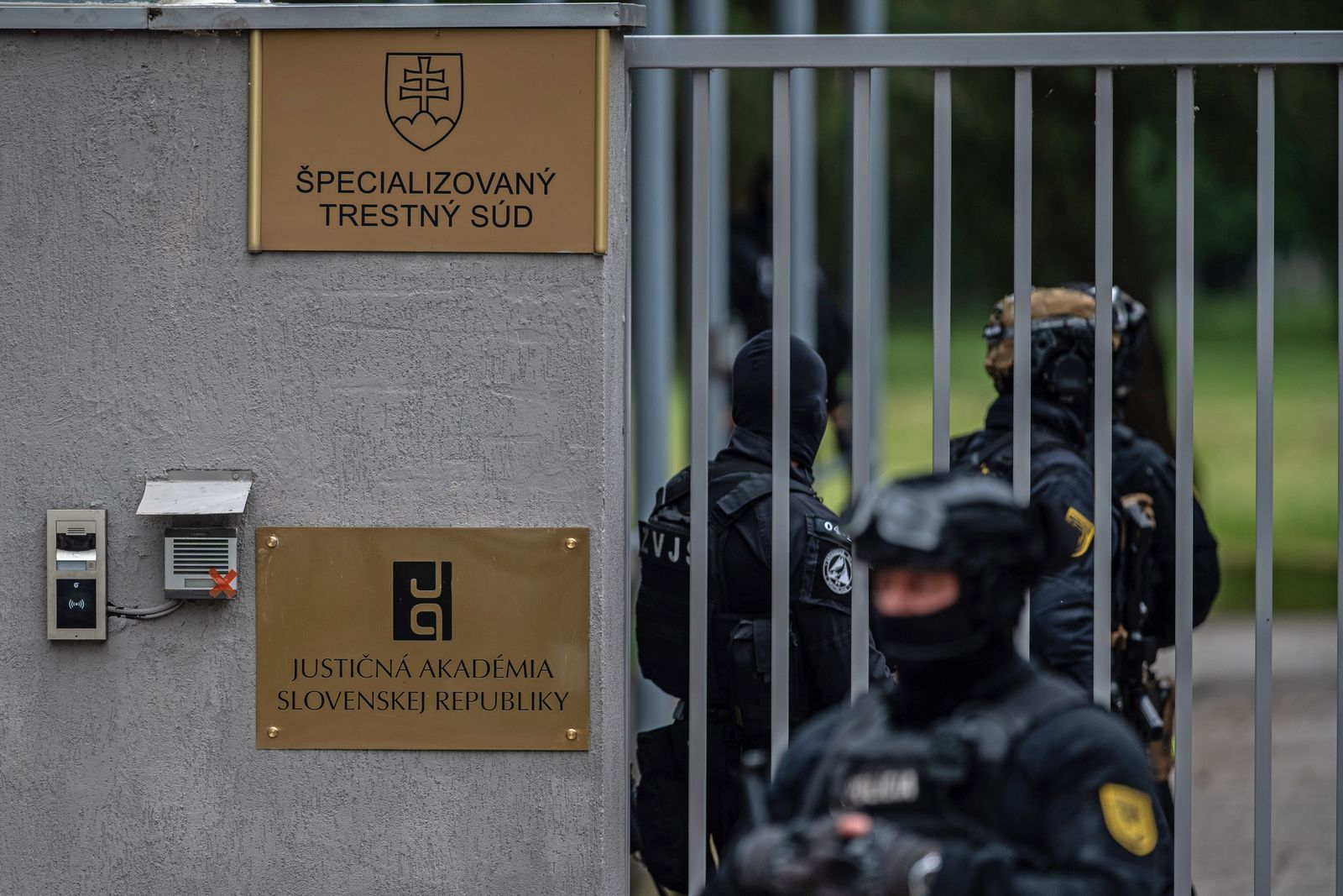 epa11349660 Police takes up position as they await the arrival of shooting suspect Juraj C., charged with the attempted murder with premeditation of Slovak Prime Minister Robert Fico, for an interrogation at the Specialized Criminal Court in Pezinok, Slovakia, 18 May 2024. Slovak Prime Minister Robert Fico was shot and injured in Handlova on 15 May and transported to a hospital in a life-threatening condition; the shooting suspect was arrested on spot. The prosecutor requests custodial prosecution of Juraj C.  EPA/JAKUB GAVLAK