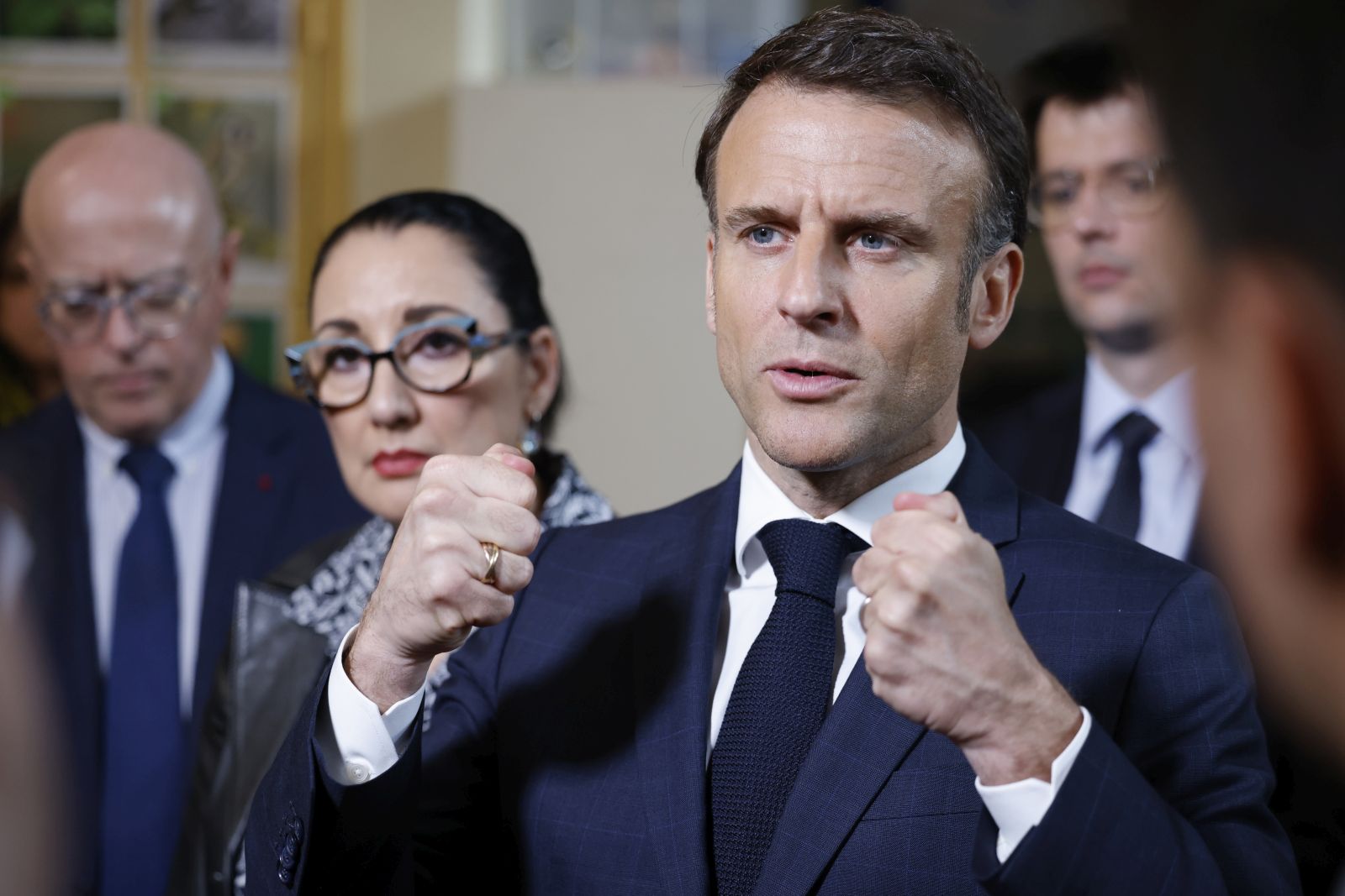 epa11260217 French President Emmanuel Macron (2-R), accompanied by France's Deputy Minister for the Elderly and Disabled, Fadila Khattabi (2-L), and Paris Academy rector Bernard Beignier (L) speaks to the media during a visit to the Blanche application primary school and Academic Autism Training Laboratory (LAB9A) in Paris, France, 05 April 2024. Three days after the World Autism Awareness Day, Macron visits LAB9A, a teacher training center for autistic children recently set up by the Paris education authority, also meeting pupils and teachers at Blanche primary school, which has had an autism teaching unit (UEEA) since the start of the 2023 academic year.  EPA/LUDOVIC MARIN / POOL  MAXPPP OUT