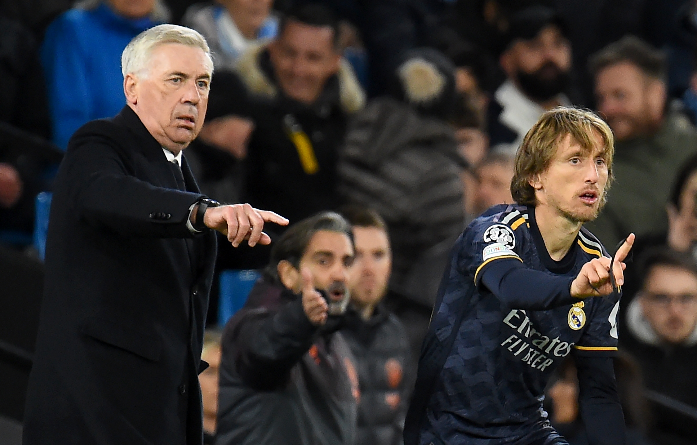 epa11285444 Real Madrid head coach Carlo Ancelotti (L) brings on Luka Modric from the bench during the UEFA Champions League quarter final, 2nd leg match between Manchester City and Real Madrid in Manchester, Britain, 17 April 2024.  EPA/PETER POWELL