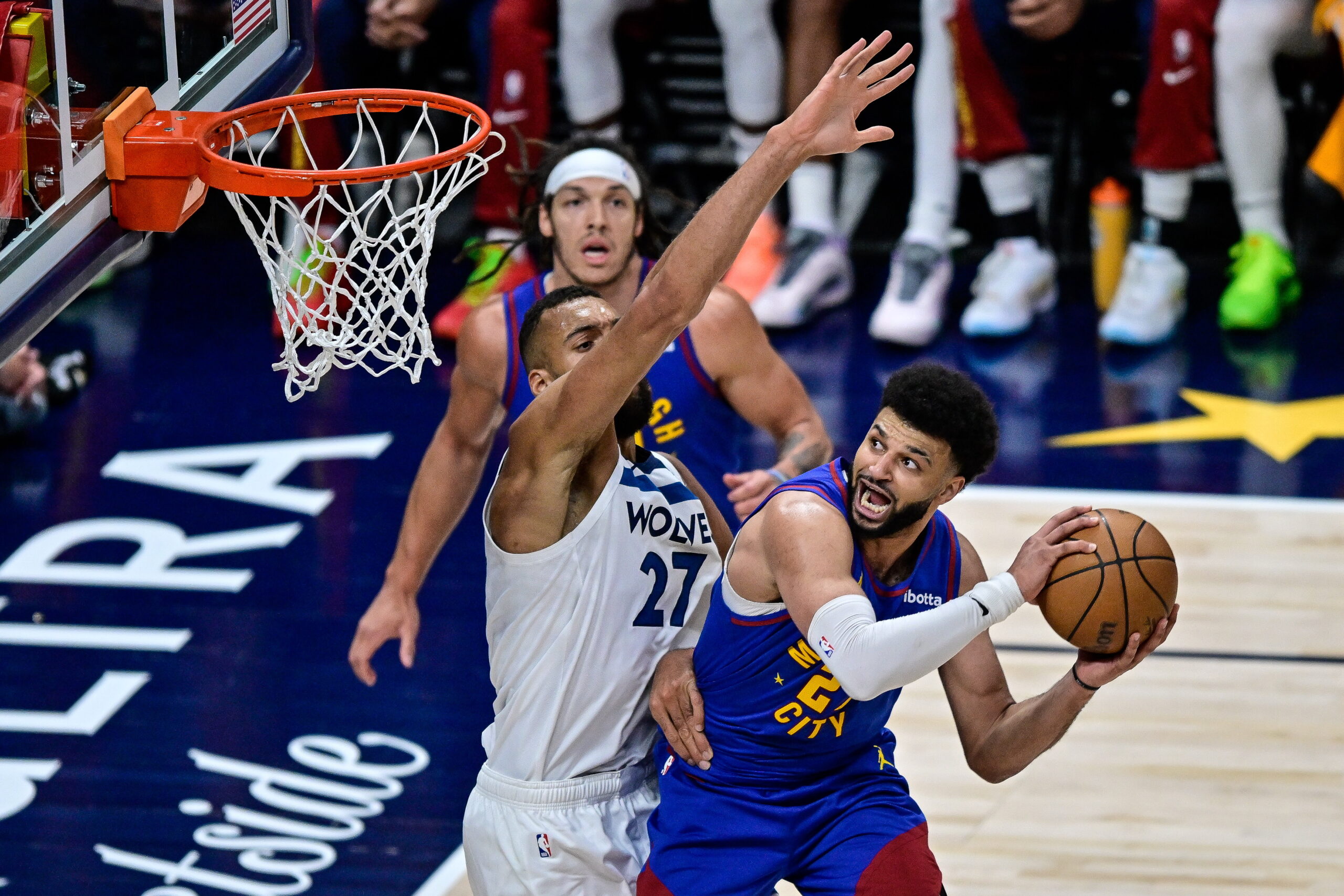 epa11318986 Denver Nuggets guard Jamal Murray (R) prepares to shoot and score under coverage by Minnesota Timberwolves center Rudy Gobert (L) during the fourth quarter of game one of the Western Conference semifinal series between the Minnesota Timberwolves and the Denver Nuggets at Ball Arena in Denver, Colorado, USA, 04 May 2024.  EPA/DUSTIN BRADFORD SHUTTERSTOCK OUT