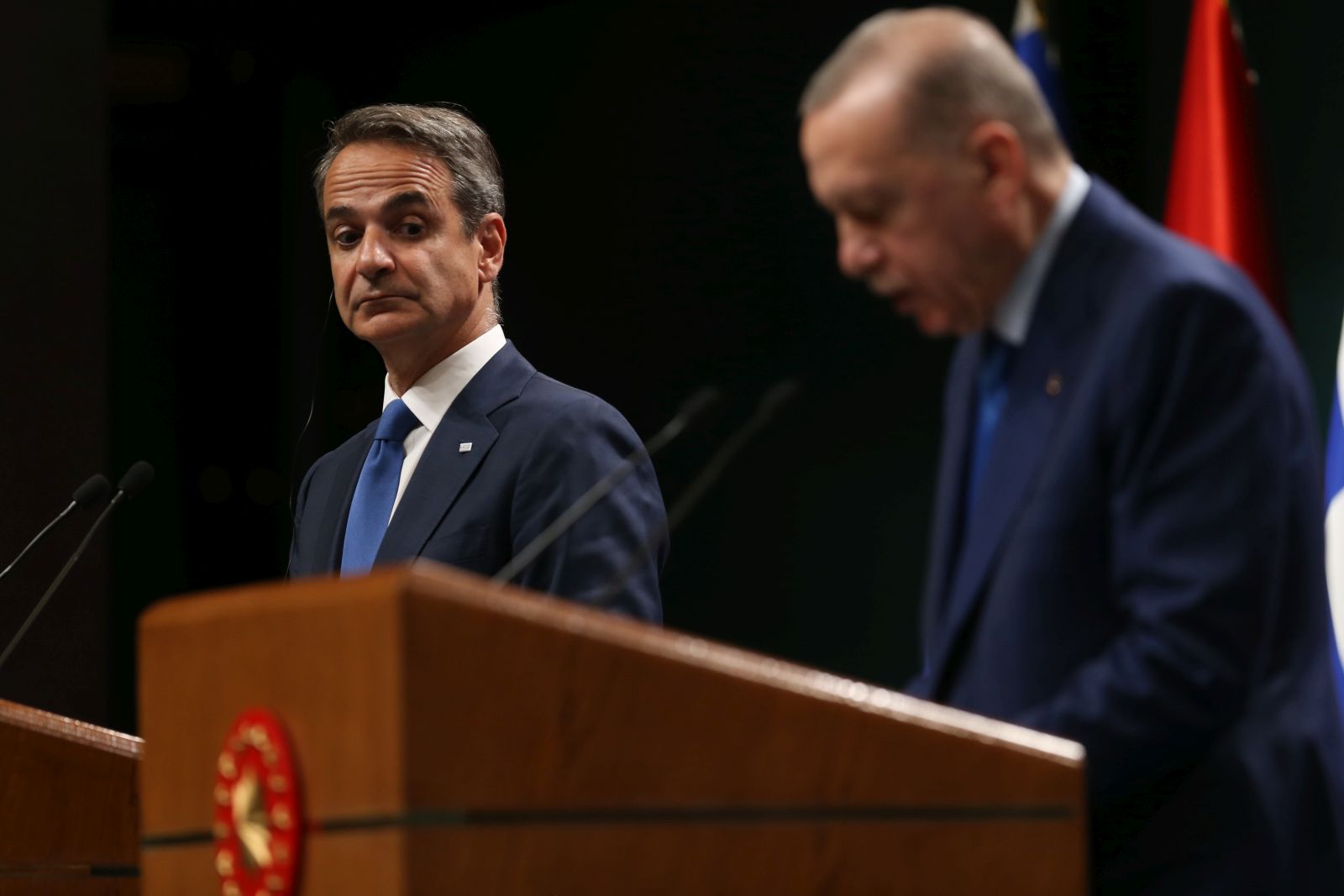 epa11337396 Greek Prime Minister Kyriakos Mitsotakis (L) looks on during a press conference withTurkish President Recep Tayyip Erdogan (R) after their meeting at the Presidential Palace in Ankara, Turkey, 13 May 2024.  EPA/NECATI SAVAS