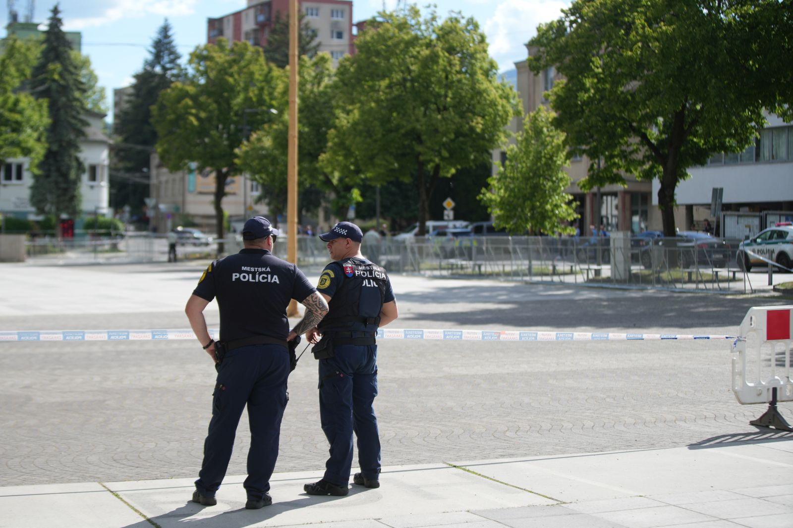 epa11342305 Police officers stand guard near the cordoned-off crime scene where Slovak Prime Minister Robert Fico was shot earlier in the day, in Handlova, Slovakia, 15 May 2024. According to a statement from the Slovak government office on 15 May, "following a government meeting in Handlova, there was an assassination attempt on the Prime Minister of the Slovak Republic Robert Fico. He is currently being transported by helicopter to Banska Bystrica Hospital in a life-threatening condition."  EPA/JAKUB GAVLAK