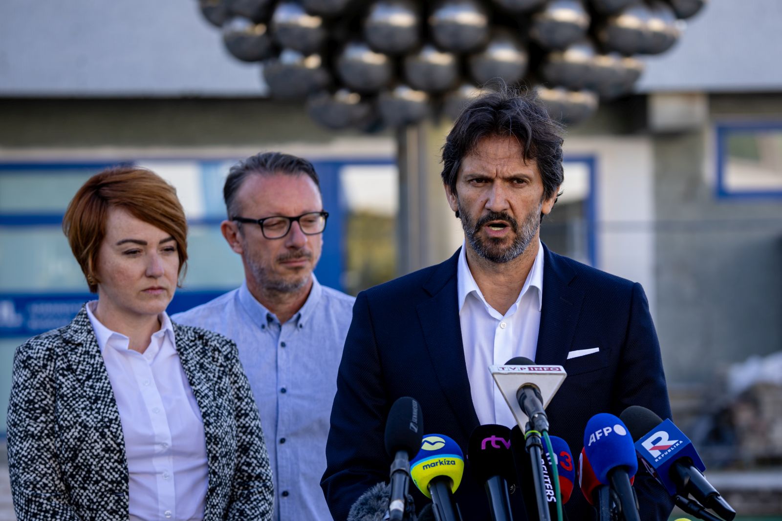 epa11343996 Slovak Defence Minister Robert Kalinak (R) and director of hospital Miriam Lapunikova (L) address the media outside the F. D. Roosevelt University Hospital, where Slovak Prime Minister Robert Fico is being treated after being shot on 15 May, in Banska Bystrica, Slovakia, 16 May 2024. The Slovak government office on 15 May confirmed there had been an assassination attempt on Prime Minister Fico following a meeting in the town of Handlova. According to Slovak Defence Minister Kalinak on 16 May, Fico was in stable but serious condition after surgery.  EPA/MARTIN DIVISEK