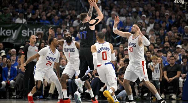 May 3, 2024; Dallas, Texas, USA; Dallas Mavericks guard Luka Doncic (77) passes the ball over LA Clippers guard Norman Powell (24) and guard James Harden (1) and guard Russell Westbrook (0) and center Ivica Zubac (40) during the first quarter during game six of the first round for the 2024 NBA playoffs at American Airlines Center. Mandatory Credit: Jerome Miron-USA TODAY Sports Photo: Jerome Miron/REUTERS