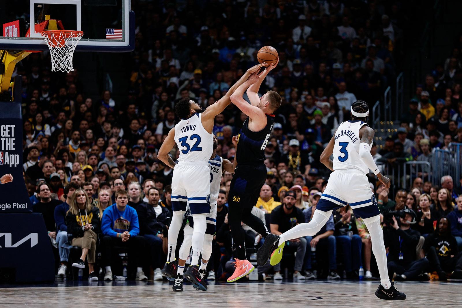 May 6, 2024; Denver, Colorado, USA; Denver Nuggets center Nikola Jokic (15) attempts a shot as Minnesota Timberwolves center Karl-Anthony Towns (32) defends in the first quarter during game two of the second round for the 2024 NBA playoffs at Ball Arena. Mandatory Credit: Isaiah J. Downing-USA TODAY Sports Photo: Isaiah J. Downing/REUTERS