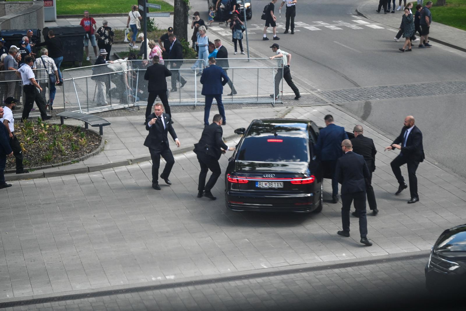 Security officers move Slovak PM Robert Fico in a car after a shooting incident, after a Slovak government meeting in Handlova, Slovakia, May 15, 2024. REUTERS/Radovan Stoklasa Photo: RADOVAN STOKLASA/REUTERS