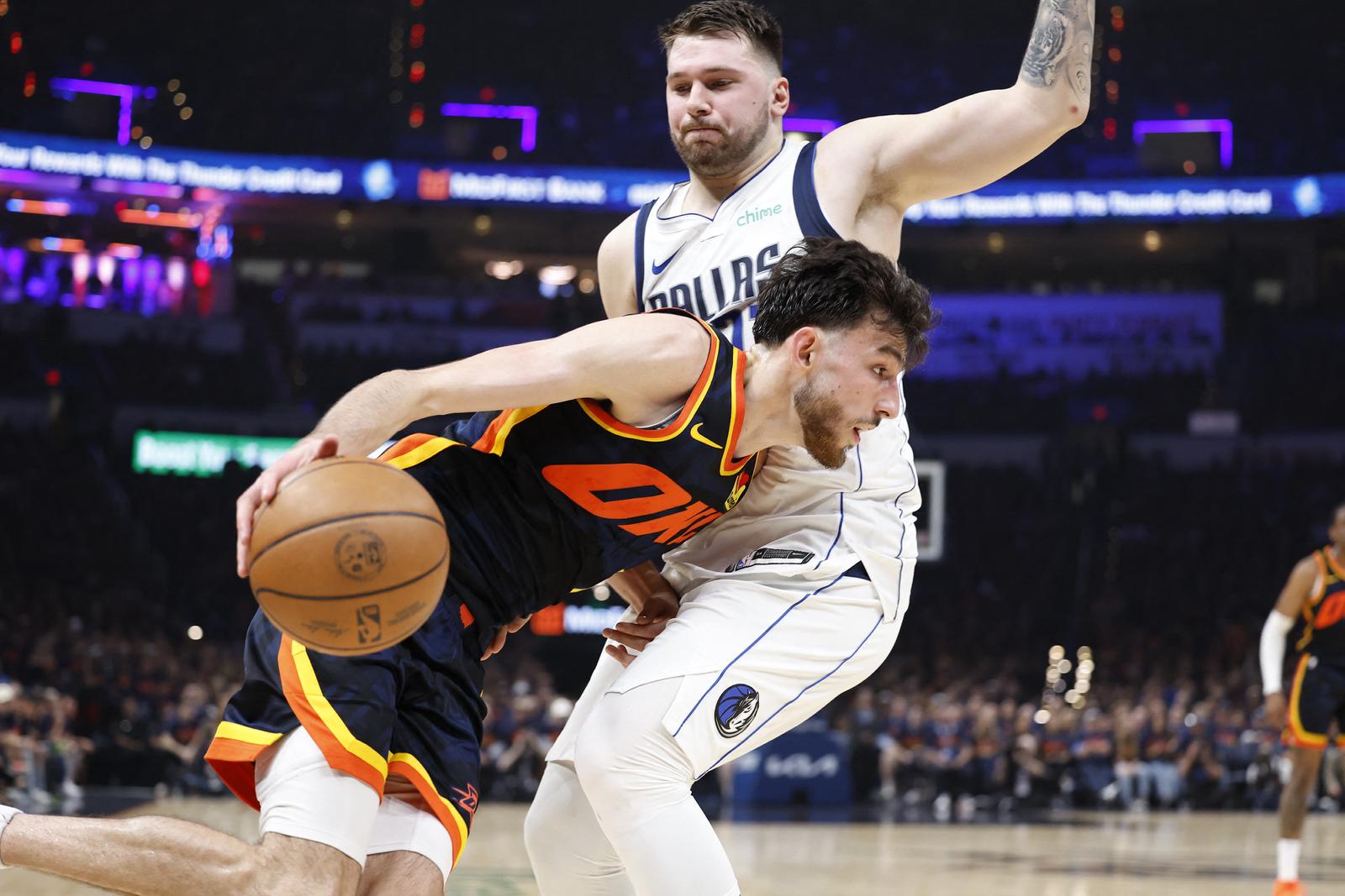 May 15, 2024; Oklahoma City, Oklahoma, USA; Oklahoma City Thunder forward Chet Holmgren (7) drives against Dallas Mavericks guard Luka Doncic (77) during the second quarter of game five of the second round for the 2024 NBA playoffs at Paycom Center. Mandatory Credit: Alonzo Adams-USA TODAY Sports Photo: Alonzo Adams/REUTERS