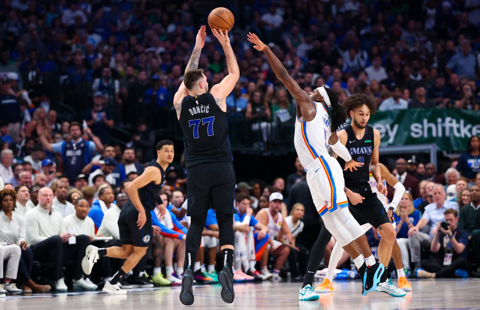 May 18, 2024; Dallas, Texas, USA;  Dallas Mavericks guard Luka Doncic (77) shoots over Oklahoma City Thunder guard Luguentz Dort (5) during the second quarter in game six of the second round of the 2024 NBA playoffs at American Airlines Center. Mandatory Credit: Kevin Jairaj-USA TODAY Sports Photo: Kevin Jairaj/REUTERS