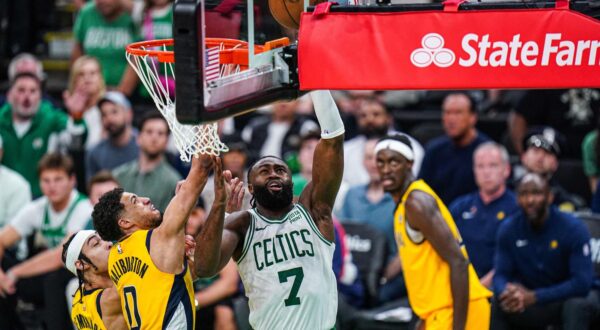May 21, 2024; Boston, Massachusetts, USA; Boston Celtics guard Jaylen Brown (7) shoots the ball against Indiana Pacers guard Tyrese Haliburton (0) in over-time during game one of the eastern conference finals for the 2024 NBA playoffs at TD Garden. Mandatory Credit: David Butler II-USA TODAY Sports Photo: David Butler II/REUTERS