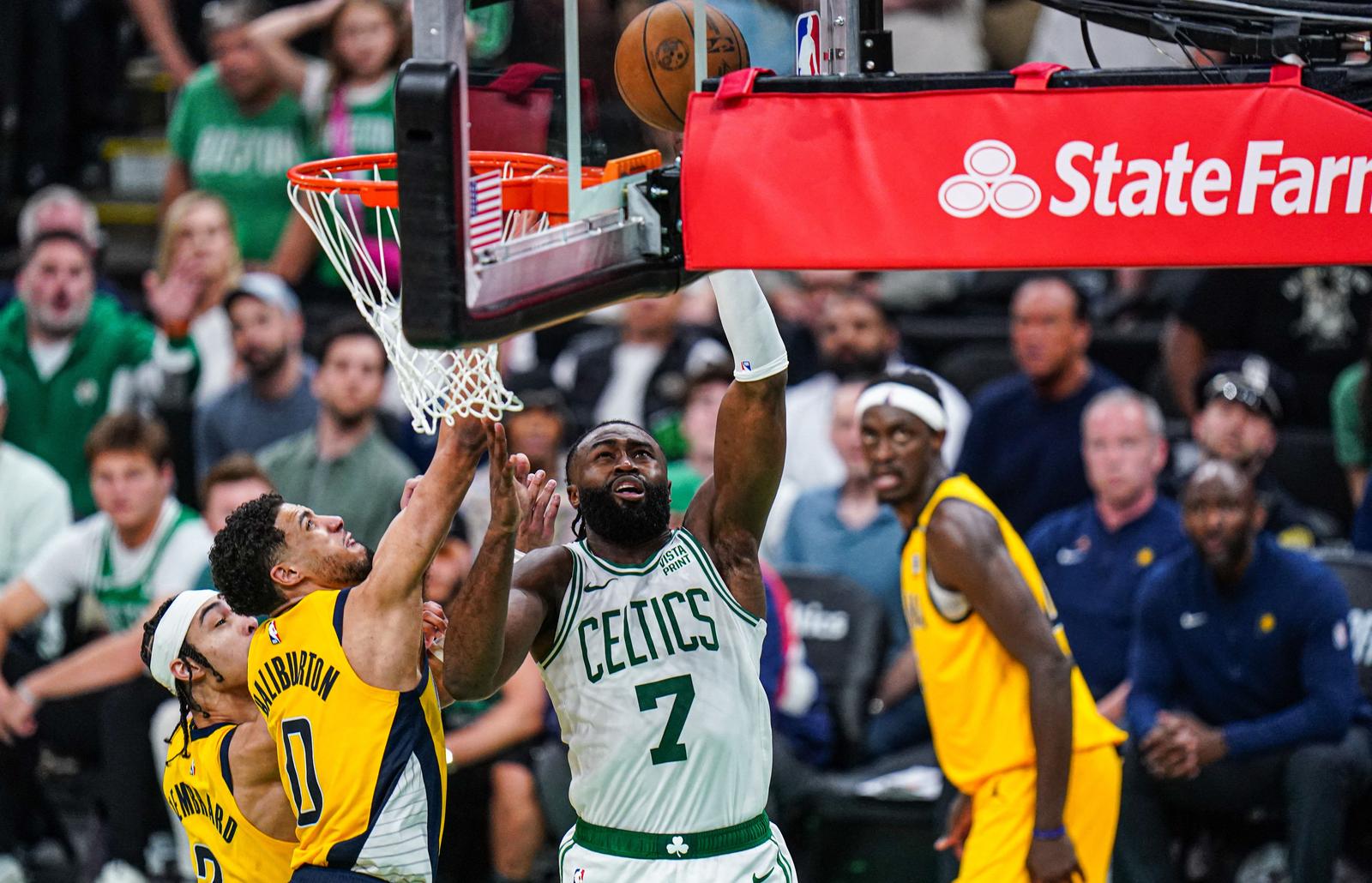 May 21, 2024; Boston, Massachusetts, USA; Boston Celtics guard Jaylen Brown (7) shoots the ball against Indiana Pacers guard Tyrese Haliburton (0) in over-time during game one of the eastern conference finals for the 2024 NBA playoffs at TD Garden. Mandatory Credit: David Butler II-USA TODAY Sports Photo: David Butler II/REUTERS