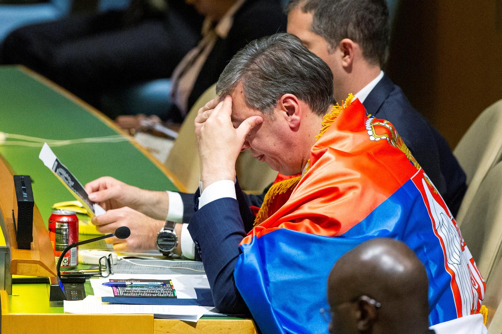 Serbian President Aleksandar Vucic wears a Serbian flag as he listens to delegates after the United Nations General Assembly's vote on the creation of an international day to commemorate the Srebrenica genocide, at the United Nations Headquarters in New York City, U.S. May 23, 2024.  REUTERS/Eduardo Munoz Photo: EDUARDO MUNOZ/REUTERS