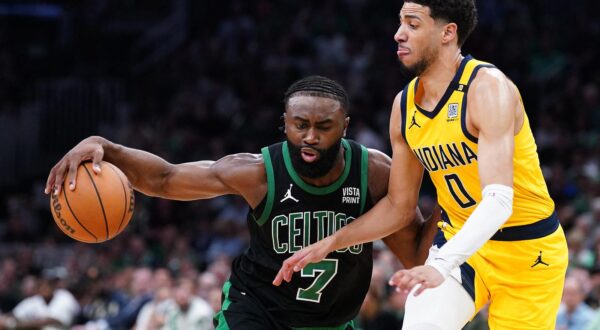May 23, 2024; Boston, Massachusetts, USA; Boston Celtics guard Jaylen Brown (7) dribbles the ball against Indiana Pacers guard Tyrese Haliburton (0) in the first half during game two of the eastern conference finals for the 2024 NBA playoffs at TD Garden. Mandatory Credit: David Butler II-USA TODAY Sports Photo: David Butler II/REUTERS