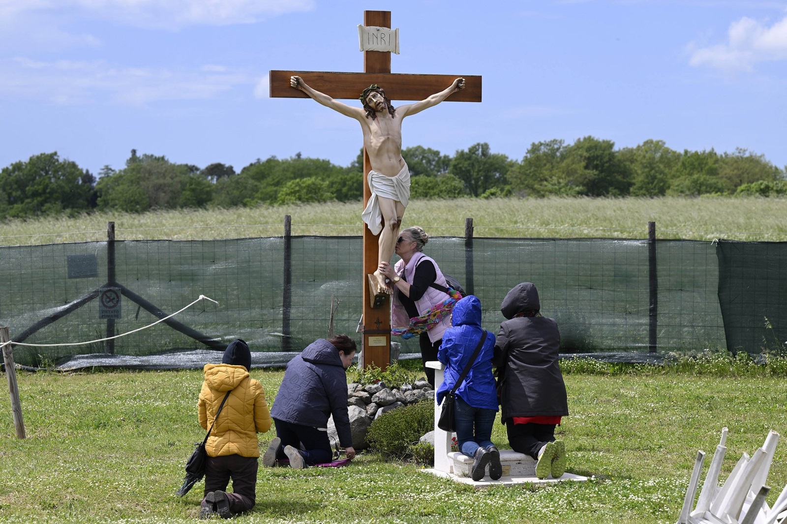 Italy, Trevignano - May 3, 2023.Crucifix next to the he statue of the Madonna of Trevignano. For almost five years, the Madonna of Trevignano on Lake Bracciano has been crying tears of blood, on the 3rd of each month.La Madonna di Trevignano al Campo delle Rose.,Image: 773761295, License: Rights-managed, Restrictions: * France, Germany and Italy Rights Out *, Model Release: no, Credit line: Mistrulli/Fotogramma / Zuma Press / Profimedia