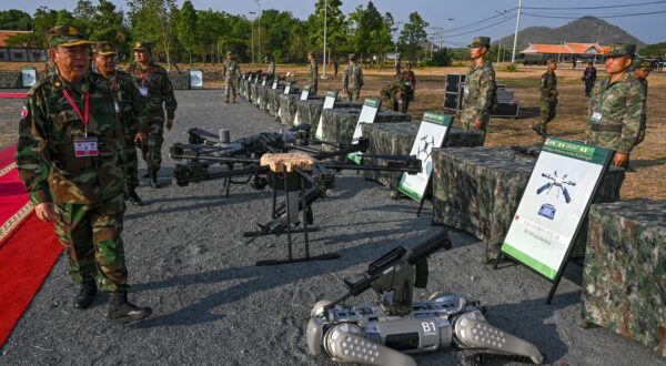 Deputy Commander-in-Chief of the Royal Cambodian Armed Forces and commander of the Royal Cambodian Army, General Mao Sophan (L), inspects drones and a machine gun equipped robot battle "dog" (R) displayed in front of Chinese soldiers during the Cambodian-Chinese Dragon Gold-2024 drill at a military police base in Kampong Chhnang province on May 16, 2024. Cambodia and China began their largest-ever joint annual military drills on May 16, 2024 to boost their army capacity amid US concerns that Beijing could use a key Cambodian naval base to expand its influence in the region.,Image: 873403442, License: Rights-managed, Restrictions: , Model Release: no, Credit line: TANG CHHIN SOTHY / AFP / Profimedia