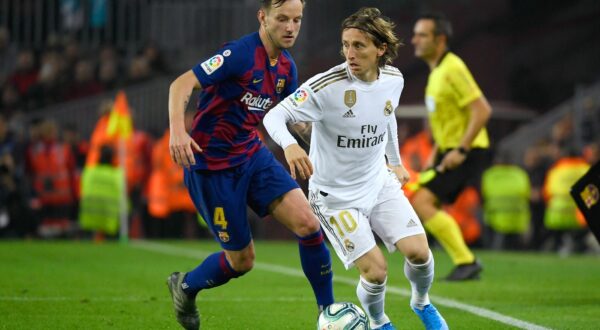 Barcelona's Croatian midfielder Ivan Rakitic (L) challenges Real Madrid's Croatian midfielder Luka Modric during the "El Clasico" Spanish League football match between Barcelona FC and Real Madrid CF at the Camp Nou Stadium in Barcelona on December 18, 2019,,Image: 488848224, License: Rights-managed, Restrictions: , Model Release: no, Credit line: LLUIS GENE / AFP / Profimedia