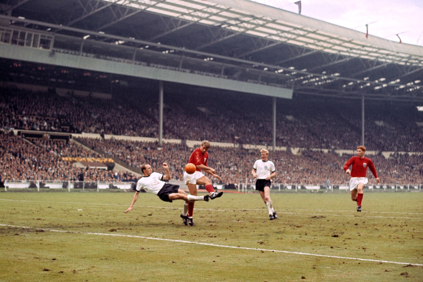 File photo dated 30-07-1966 of (L-R) West Germany's Willi Schulz challenges England's Roger Hunt, watched by teammate Karl-Heinz Schnellinger and England's Alan Ball (right).,Image: 518584511, License: Rights-managed, Restrictions: FILE PHOTO, Model Release: no, Credit line: PA Photos / PA Images / Profimedia