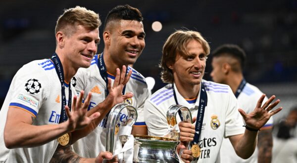 (From L) Real Madrid's German midfielder Toni Kroos, Real Madrid's Brazilian midfielder Casemiro and Real Madrid's Croatian midfielder Luka Modric pose with the trophy after winning the UEFA Champions League final football match between Liverpool and Real Madrid at the Stade de France in Saint-Denis, north of Paris, on May 28, 2022.,Image: 695348995, License: Rights-managed, Restrictions: , Model Release: no, Credit line: Anne-Christine POUJOULAT / AFP / Profimedia