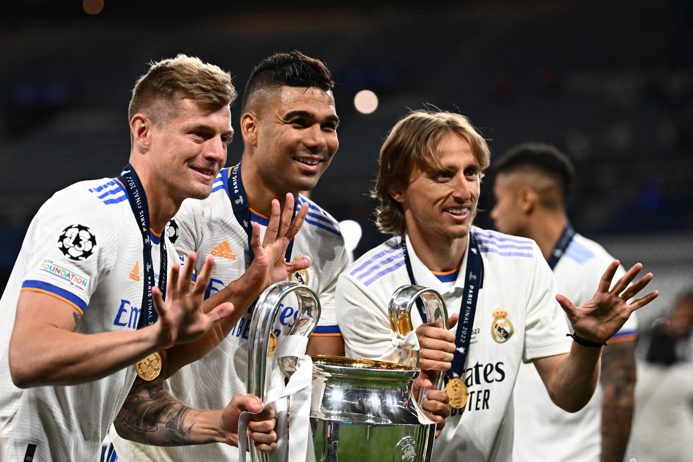 (From L) Real Madrid's German midfielder Toni Kroos, Real Madrid's Brazilian midfielder Casemiro and Real Madrid's Croatian midfielder Luka Modric pose with the trophy after winning the UEFA Champions League final football match between Liverpool and Real Madrid at the Stade de France in Saint-Denis, north of Paris, on May 28, 2022.,Image: 695348995, License: Rights-managed, Restrictions: , Model Release: no, Credit line: Anne-Christine POUJOULAT / AFP / Profimedia