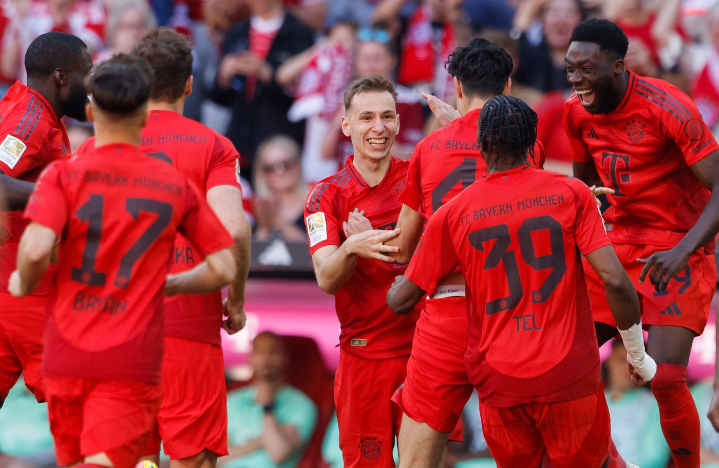 Bayern Munich's Croatian midfielder #34 Lovro Zvonarek (C) celebrates scoring the opening goal with his teammates during German first division Bundesliga football match between FC Bayern Munich and VfL Wolfsburg in Munich, southern Germany on May 12, 2024.,Image: 872268031, License: Rights-managed, Restrictions: DFL REGULATIONS PROHIBIT ANY USE OF PHOTOGRAPHS AS IMAGE SEQUENCES AND/OR QUASI-VIDEO, Model Release: no, Credit line: Michaela STACHE / AFP / Profimedia