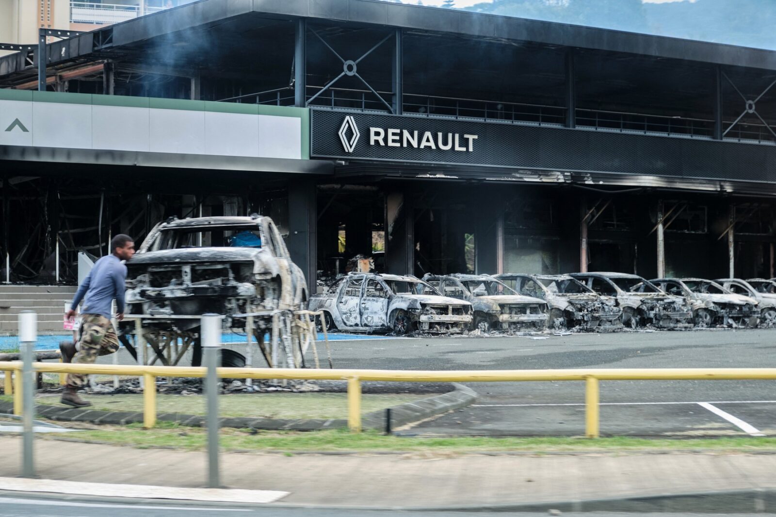 This photograph shows a view of burnt cars and a burnt Renault car shop amid protests linked to a debate on a constitutional bill aimed at enlarging the electorate for upcoming elections in the overseas French territory of New Caledonia, in Noumea, on May 14, 2024. After scenes of violence of "great intensity" including burned vehicles, looted stores and clashes between demonstrators and the police, a curfew was decreed in Noumea, 17,000 kilometers from Paris, as the independentists of the overseas French territory of New Caledonia oppose a constitutional revision they fear will "further minimize the indigenous Kanak people".,Image: 872696346, License: Rights-managed, Restrictions: , Model Release: no, Credit line: Theo ROUBY / AFP / Profimedia