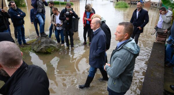 German Chancellor Olaf Scholz wades through water as they visit flood stricken town of Kleinblittersdorf on May 18, 2024, after heavy rains caused flooding, swamping streets and buildings and sparking evacuations in south west Germany. In the southwestern German state of Saarland, streets were deep underwater and images on social media showed emergency workers carrying local residents to safety in boats. State capital Saarbruecken was hard hit while German daily Bild reported that a breach in a dyke in the town of Quierschied led to a power station in the area being shut down.,Image: 874117690, License: Rights-managed, Restrictions: , Model Release: no, Credit line: Iris Maria Maurer / AFP / Profimedia