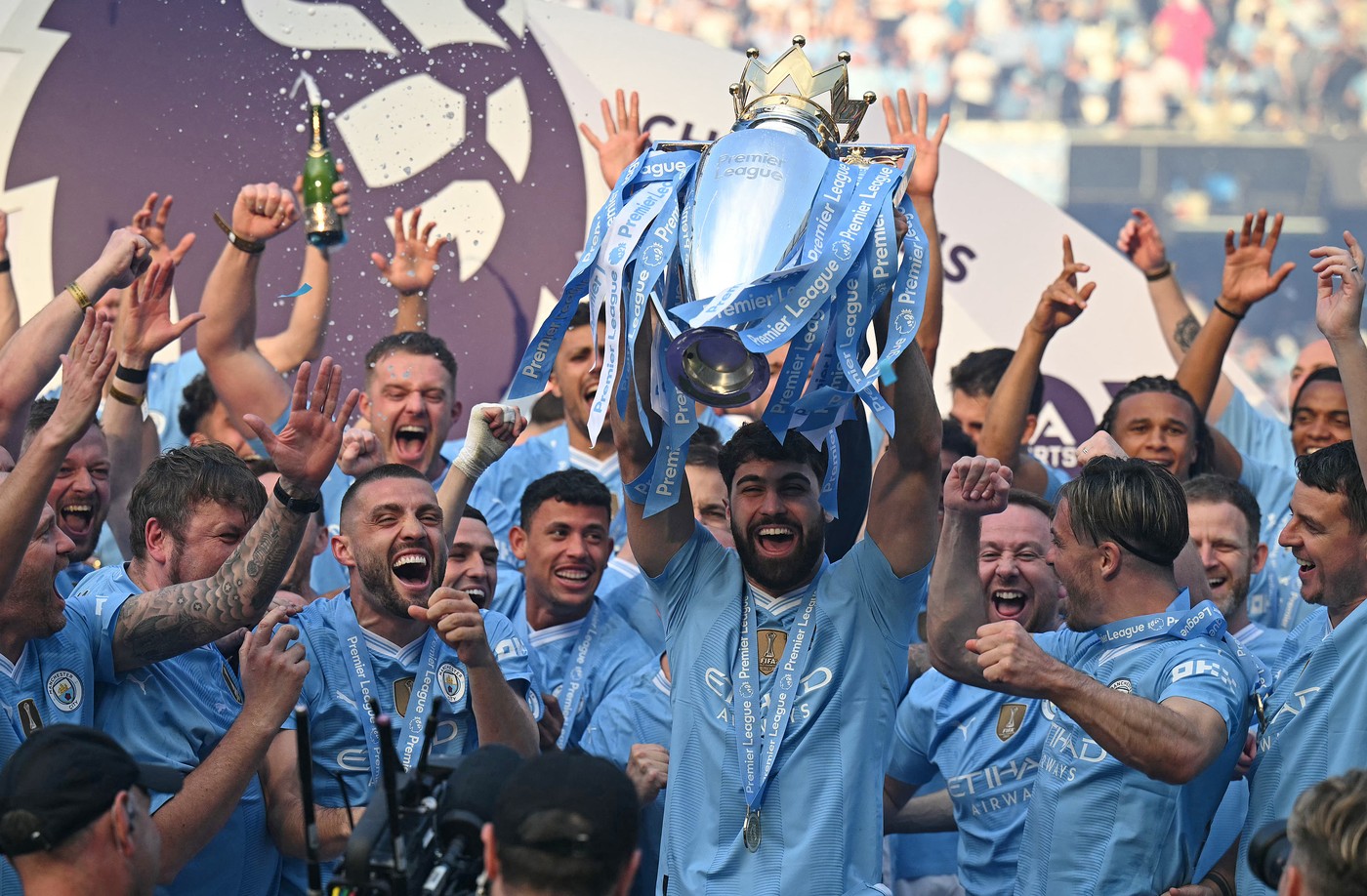 Manchester City's Croatian defender #24 Josko Gvardiol poses with the Premier League trophy after the presentation ceremony following the English Premier League football match between Manchester City and West Ham United at the Etihad Stadium in Manchester, north west England, on May 19, 2024. Manchester City created English football history on Sunday, beating West Ham 3-1 to win an unprecedented fourth straight Premier League title.,Image: 874551989, License: Rights-managed, Restrictions: RESTRICTED TO EDITORIAL USE. No use with unauthorized audio, video, data, fixture lists, club/league logos or 'live' services. Online in-match use limited to 120 images. An additional 40 images may be used in extra time. No video emulation. Social media in-match use limited to 120 images. An additional 40 images may be used in extra time. No use in betting publications, games or single club/league/player publications., Model Release: no, Credit line: Oli SCARFF / AFP / Profimedia