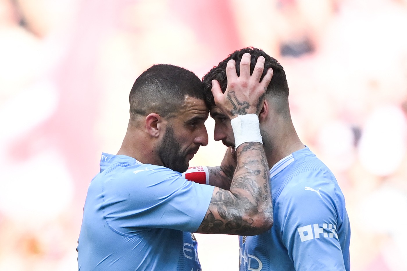 Manchester City's English defender #02 Kyle Walker (L) consols Manchester City's Croatian defender #24 Josko Gvardiol after loosing the English FA Cup final football match between Manchester City and Manchester United at Wembley stadium, in London, on May 25, 2024. Manchester United wins 2 - 1 against Manchester City.,Image: 876373965, License: Rights-managed, Restrictions: NOT FOR MARKETING OR ADVERTISING USE / RESTRICTED TO EDITORIAL USE, Model Release: no, Credit line: JUSTIN TALLIS / AFP / Profimedia