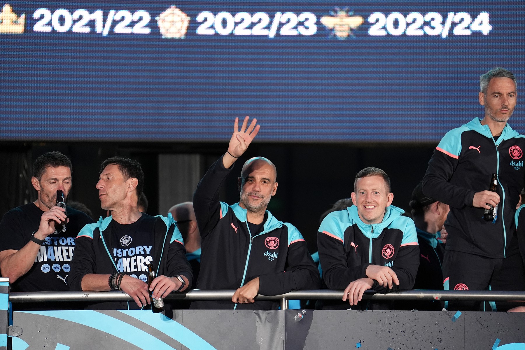 Manchester City manager Pep Guardiola holds up four fingers during a trophy parade in Manchester, after they won their fourth successive Premier League title and their sixth in seven years. Picture date: Sunday May 26, 2024.,Image: 876695971, License: Rights-managed, Restrictions: Use subject to restrictions. Editorial use only, no commercial use without prior consent from rights holder., Model Release: no, Credit line: Martin Rickett / PA Images / Profimedia