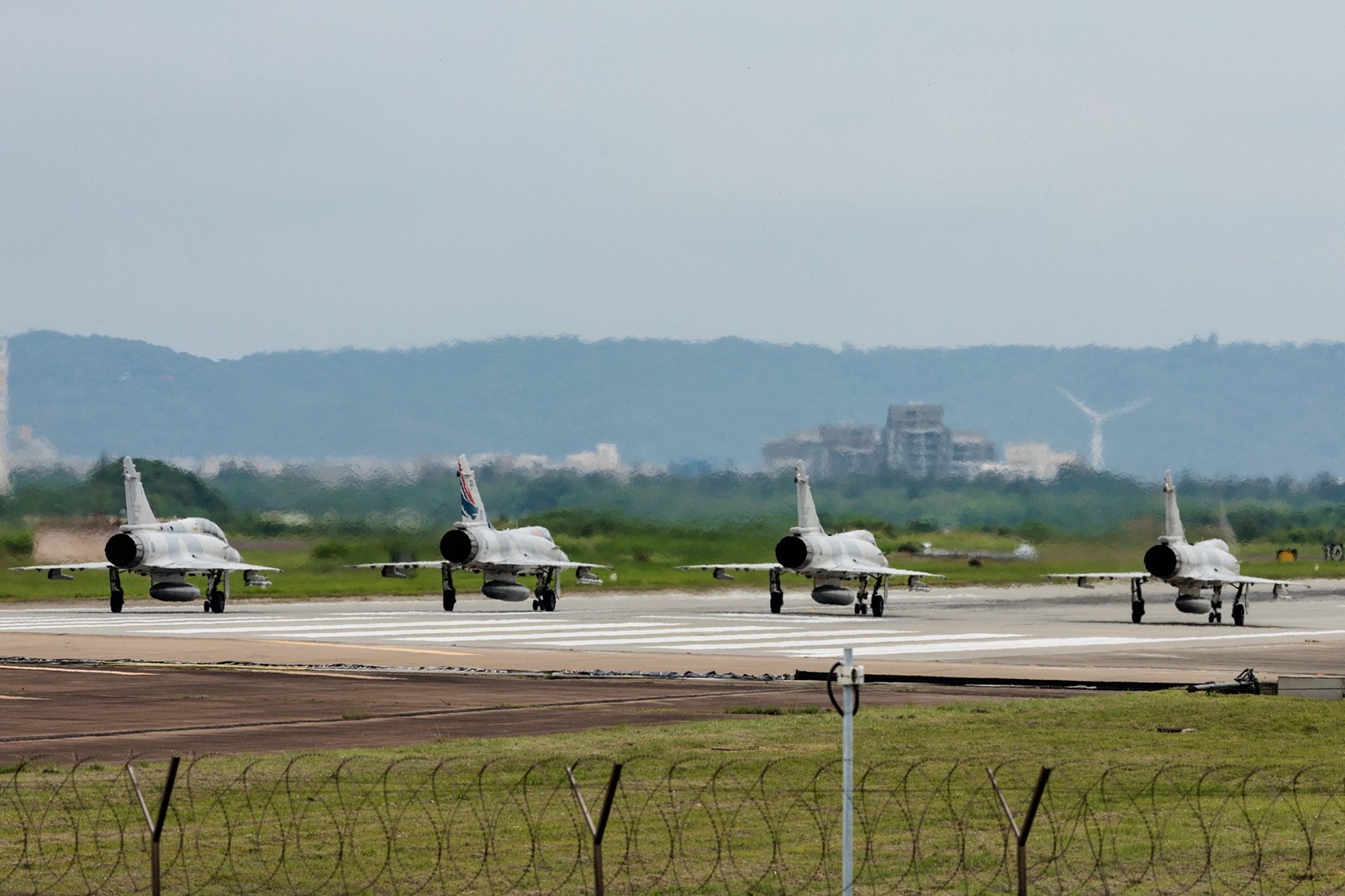 Taiwanese air force Mirage 2000 fighter jets wait for take off at a base in Hsinchu in northern Taiwan on May 23, 2024. China on May 23 encircled Taiwan with naval vessels and military aircraft in war games aimed at punishing the self-ruled island after its new president vowed to defend democracy.,Image: 875677898, License: Rights-managed, Restrictions: , Model Release: no, Credit line: Yasuyoshi CHIBA / AFP / Profimedia
