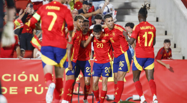 Spain's Pedri, center, is congratulated after scoring his side's first goal during the international friendly soccer match between Spain and Northern Ireland at the Son Moix stadium in Palma de Mallorca, Spain, Saturday, June 8, 2024. (AP Photo/Francisco Ubilla)