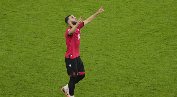 Georgia's Georges Mikautadze celebrates after scoring his side's second goal during a Group F match between Georgia and Portugal at the Euro 2024 soccer tournament in Gelsenkirchen, Germany, Wednesday, June 26, 2024. (AP Photo/Andreea Alexandru)