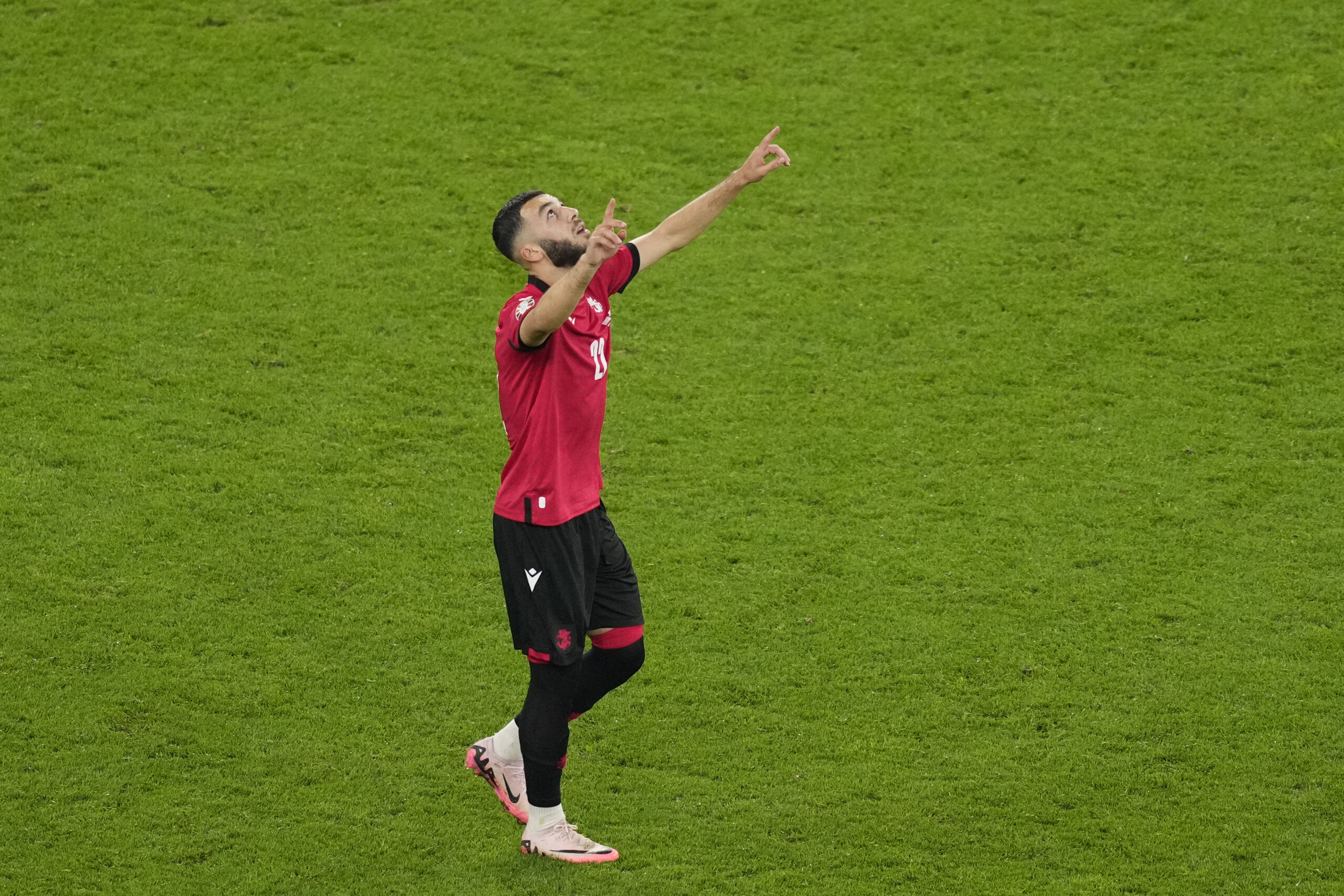 Georgia's Georges Mikautadze celebrates after scoring his side's second goal during a Group F match between Georgia and Portugal at the Euro 2024 soccer tournament in Gelsenkirchen, Germany, Wednesday, June 26, 2024. (AP Photo/Andreea Alexandru)