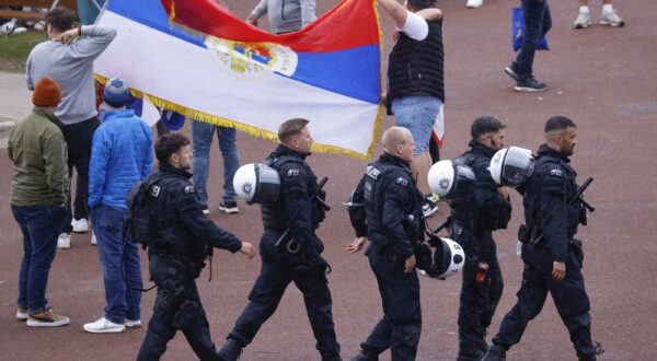Police officers patrol as supporters arrive at the Arena AufSchalke ahead of the UEFA Euro 2024 Group C football match between Serbia and England in Gelsenkirchen on June 16, 2024. Gelsenkirchen has been declared high risk by the police due to fears Serbian ultras could clash with the tens of thousands of England fans that have made the trip to north-west Germany.,Image: 882124836, License: Rights-managed, Restrictions: , Model Release: no, Credit line: Kenzo TRIBOUILLARD / AFP / Profimedia