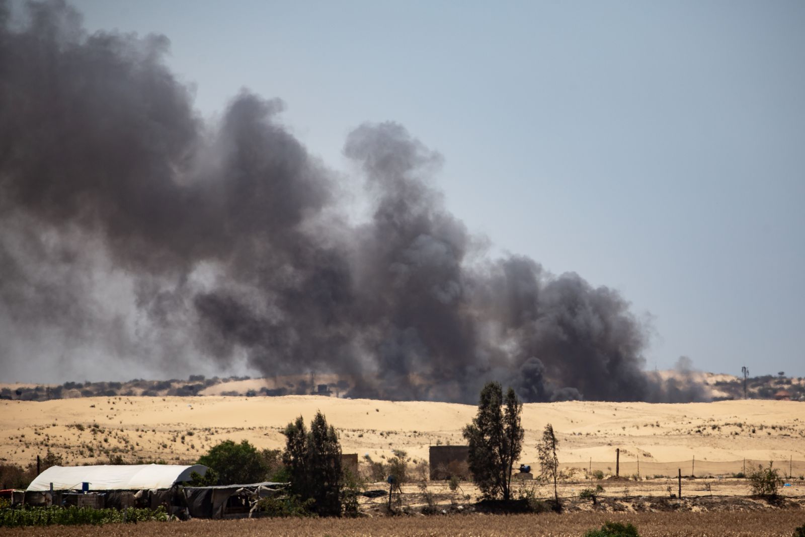 epa11379499 Smoke rises after an Israeli air strike on Rafah, southern Gaza Strip, 30 May 2024. More than 36,000 Palestinians and over 1,400 Israelis have been killed, according to the Palestinian Health Ministry and the Israel Defense Forces (IDF), since Hamas militants launched an attack against Israel from the Gaza Strip on 07 October 2023, and the Israeli operations in Gaza and the West Bank which followed it.  EPA/HAITHAM IMAD