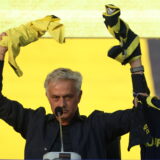 epa11386179 Jose Mourinho (C) waves to fans as he is presented as Fenerbahce's new head coach during a ceremony at the Ulker Stadium in Istanbul, Turkey, 02 June 2024. Jose Mourinho signs a two-year contract with Fenerbahce.  EPA/ERDEM SAHIN