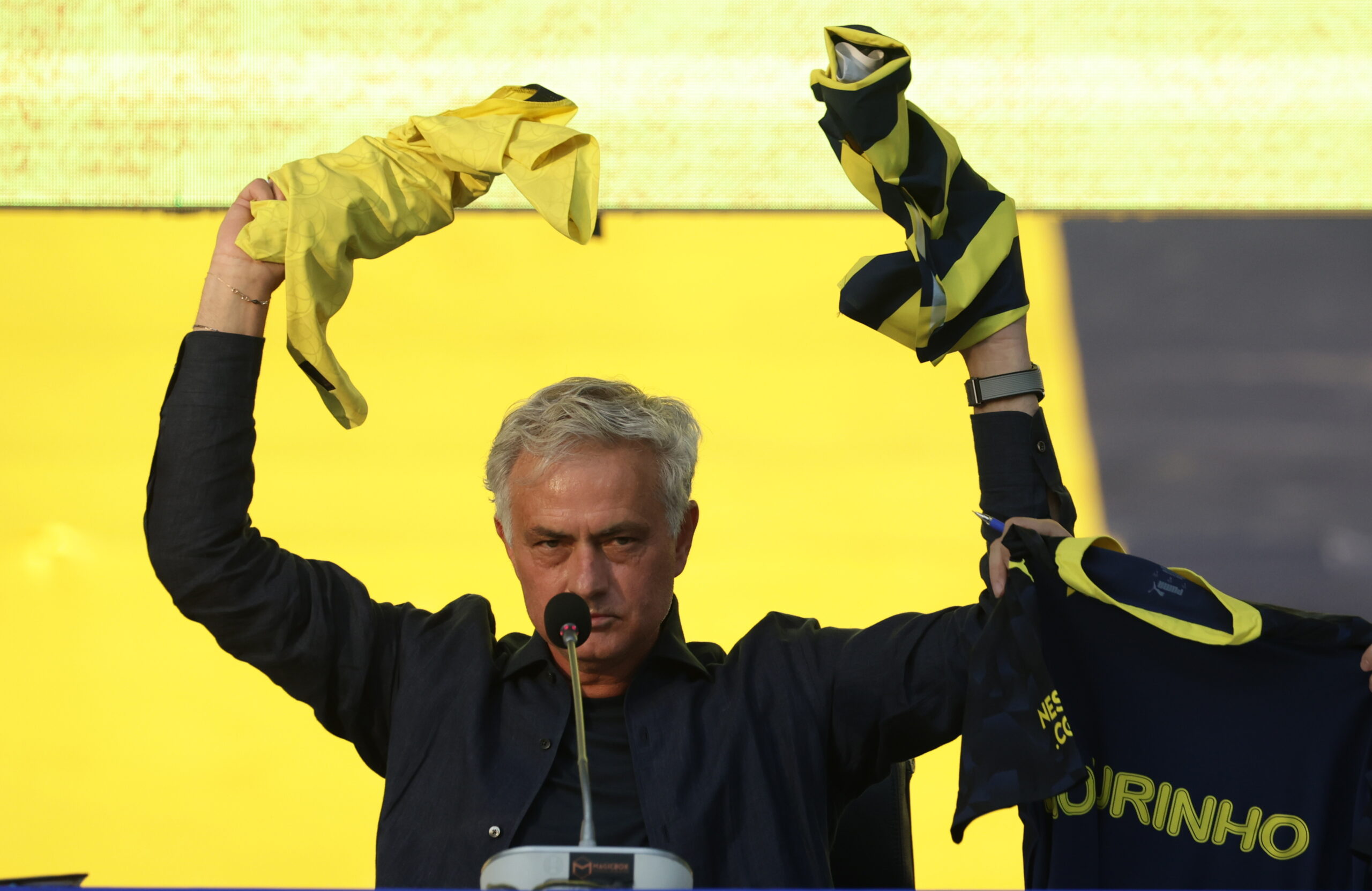 epa11386179 Jose Mourinho (C) waves to fans as he is presented as Fenerbahce's new head coach during a ceremony at the Ulker Stadium in Istanbul, Turkey, 02 June 2024. Jose Mourinho signs a two-year contract with Fenerbahce.  EPA/ERDEM SAHIN