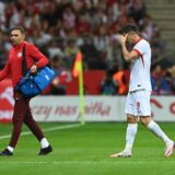 epa11402973 Robert Lewandowski (R) of Poland leaves the pitch after being injured during the international friendly soccer match between Poland and Turkey, in Warsaw, Poland, 10 June 2024.  EPA/Piotr Nowak POLAND OUT