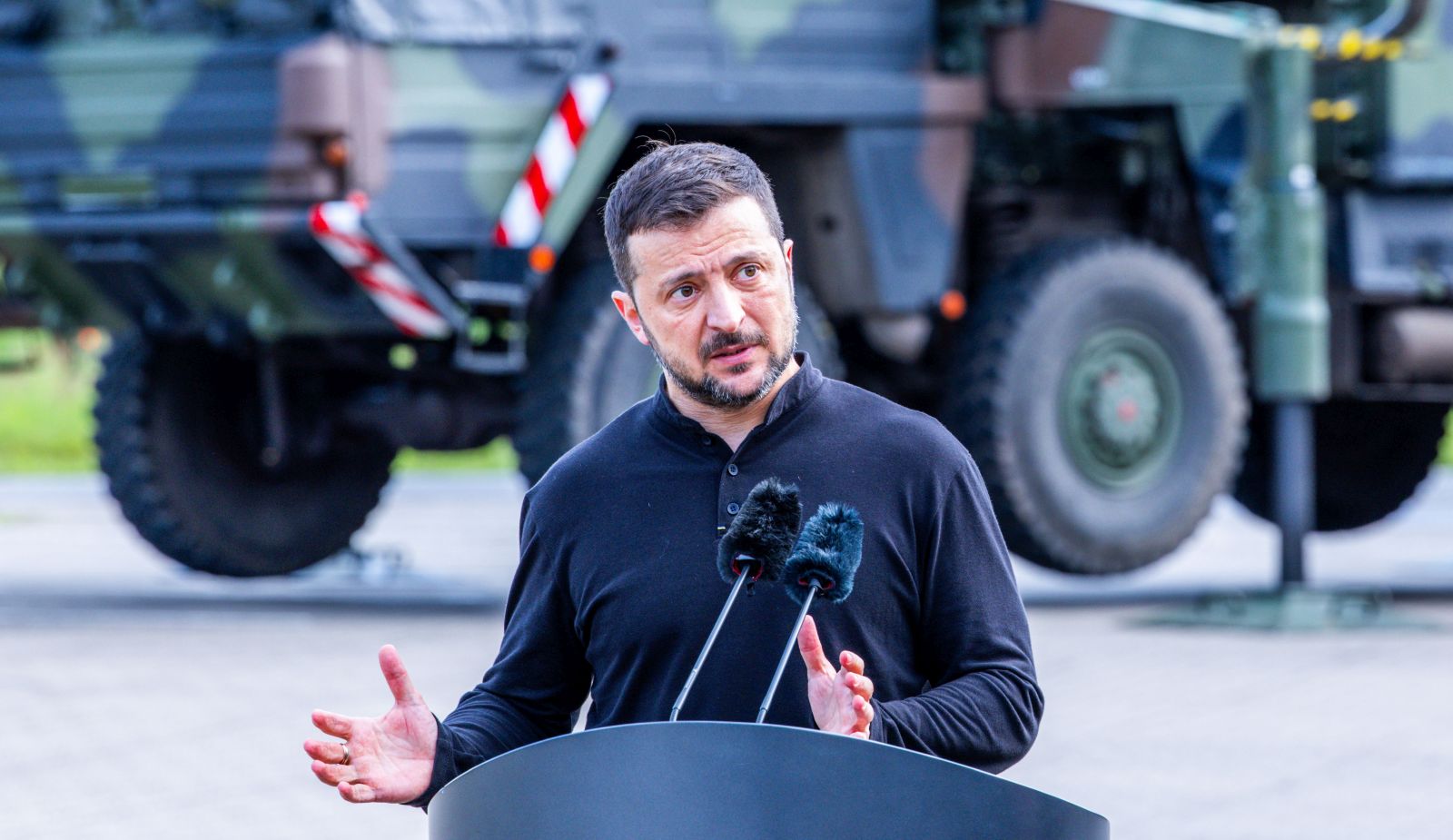 epa11404628 President of Ukraine Volodymyr Zelensky speaks at a press conference during a visit to the training of Ukrainian soldiers on the 'Patriot' anti-aircraft missile system at a military training area in Germany, 11 June 2024. Ukrainina President visits Germany to take part in The Ukraine Recovery Conference 2024 that takes place in Berlin from 11 to 12 June 2024, under the slogan 'United in defense. United in recovery. Stronger together.'  EPA/JENS BUETTNER / POOL
