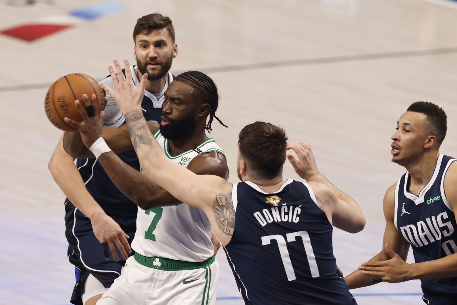 epa11406923 Boston Celtics guard Jaylen Brown (2-L) in action with Dallas Mavericks guard Luka Doncic during the first half of the NBA Finals game three in Arlington, Texas, USA, 12 June 2024.  EPA/ADAM DAVIS SHUTTERSTOCK OUT