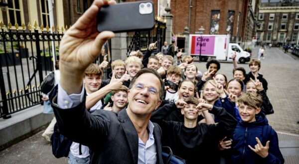 epa11427332 Dutch outgoing Prime Minister Mark Rutte (front) takes a selfie picture with youths as he arrives at the Binnenhof for the Council of Ministers, in the Hague, Netherlands, 21 June 2024. Rutte will chair the weekly cabinet of ministers for the last time on 21 June, after Dick Schoof was nominated to succeed Rutte as prime minister at the end of May 2024. Rutte, who is the only candidate left running for NATO's top job of secretary general after Romanian President Iohannis announced he was withdrawing his candidacy, has yet to be officially confirmed by NATO member states.  EPA/ROBIN UTRECHT