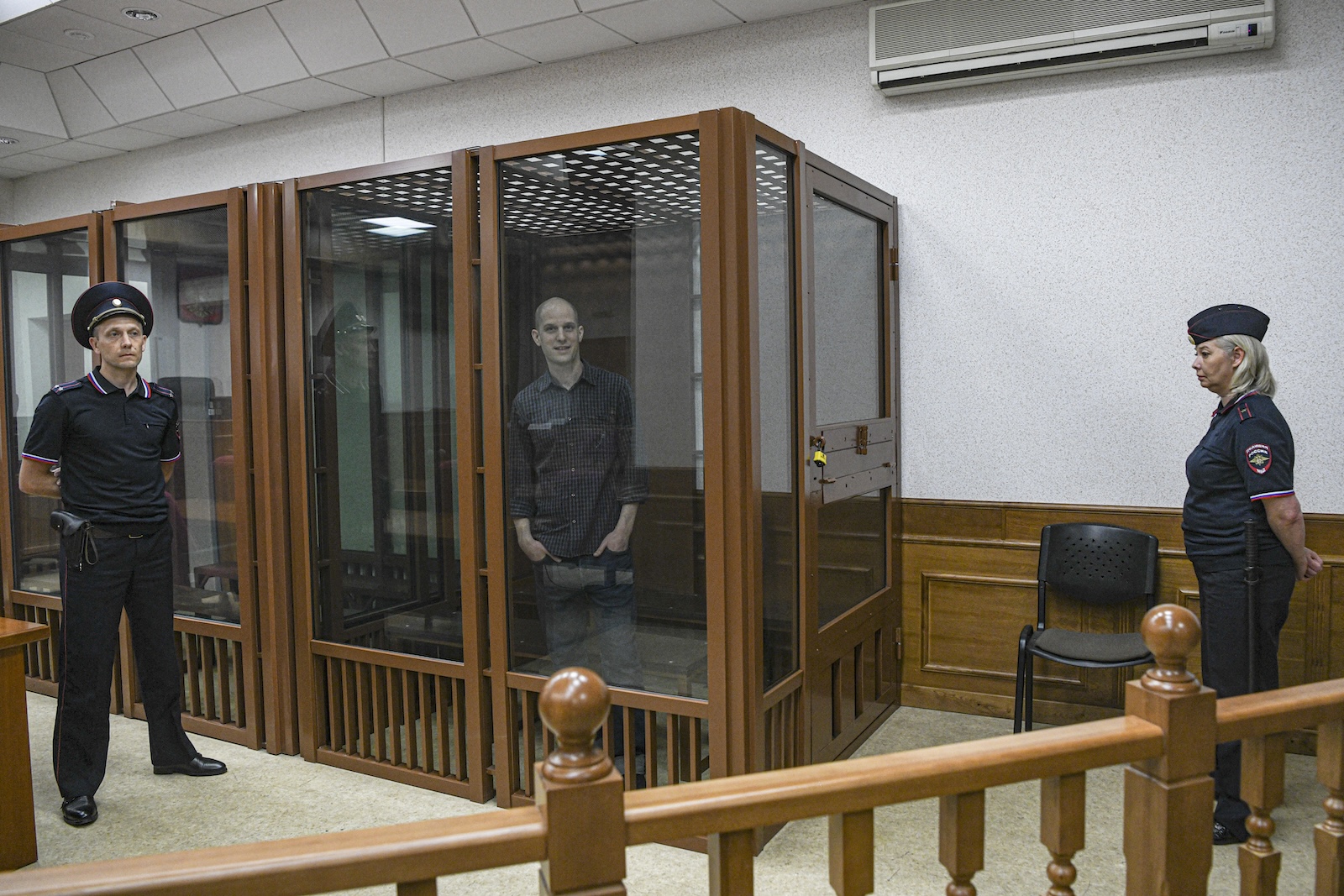 epa11438407 WSJ correspondent Evan Gershkovich stands in a glass cage prior to a hearing in Yekaterinburg's Sverdlovsk Regional Court, Yekaterinburg, Russia, 26 June 2024. Evan Gershkovich, a US journalist of The Wall Street Journal covering Russia, was detained in Yekaterinburg on 29 March 2023. The Russia's Federal Security Service (FSB) claimed that on the instructions of the American authorities, the journalist collected information constituting a state secret about one of the enterprises of the Russian military-industrial complex. He is charged with espionage under Art. 276 of the Criminal Code of the Russian Federation, which could carry a sentence of up to 20 years.  EPA/STRINGER