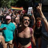 epa11447341 Members of LGBTIQ+ community wave rainbow-colored flags and shout slogans during the Pride March in Istanbul, Turkey, 30 June 2024. The Turkish Government has banned the Istanbul Pride March as they already did in previous years.  EPA/ERDEM SAHIN