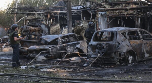 epa11446154 Ukrainian police officers inspect the damage after shelling in Vilniansk, Zaporizhzhia region, southeastern Ukraine, 29 June 2024, amid the Russian invasion. At least seven people have been killed, including two children, and 18 others injured, including four children, after a Russian rocket strike hit the city of Vilniansk, the State Emergency Service of Ukraine (SESU) said. Russian troops entered Ukrainian territory on 24 February 2022, starting a conflict that has provoked destruction and a humanitarian crisis.  EPA/KATERYNA KLOCHKO