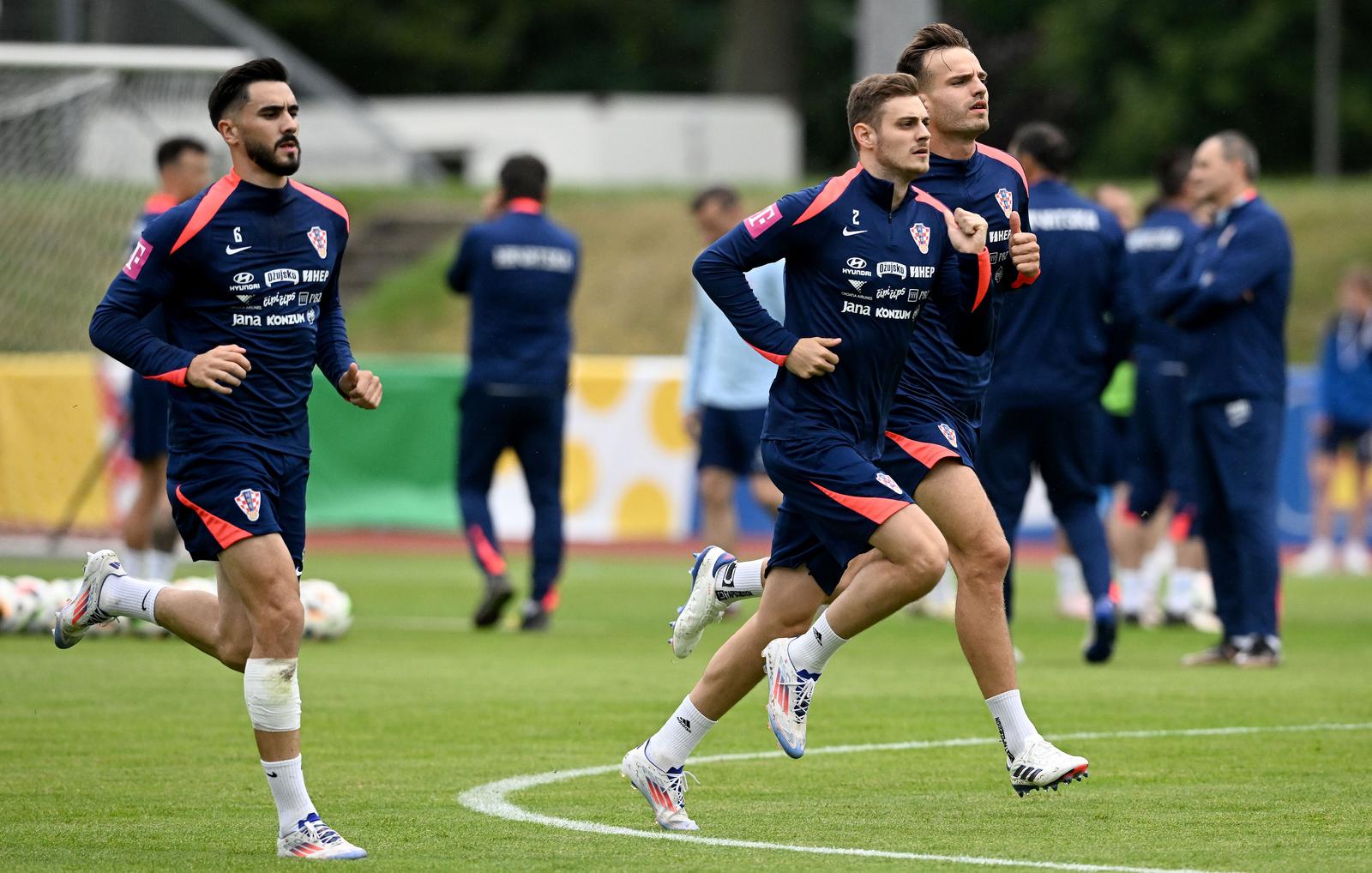 10.06.2024., Neuruppin, Njemacka -  Otvoreni trening hrvatske nogometne reprezentacije na kojem su nazocili navijaci iz lokalnog stanovnistva. Josip Sutalo, Josip Stanisic, Marin Pogracic Photo: Marko Lukunic/PIXSELL